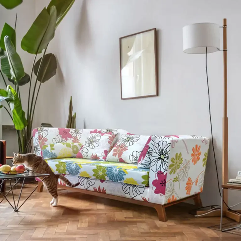 retro teak wood sofa with floral upholstery